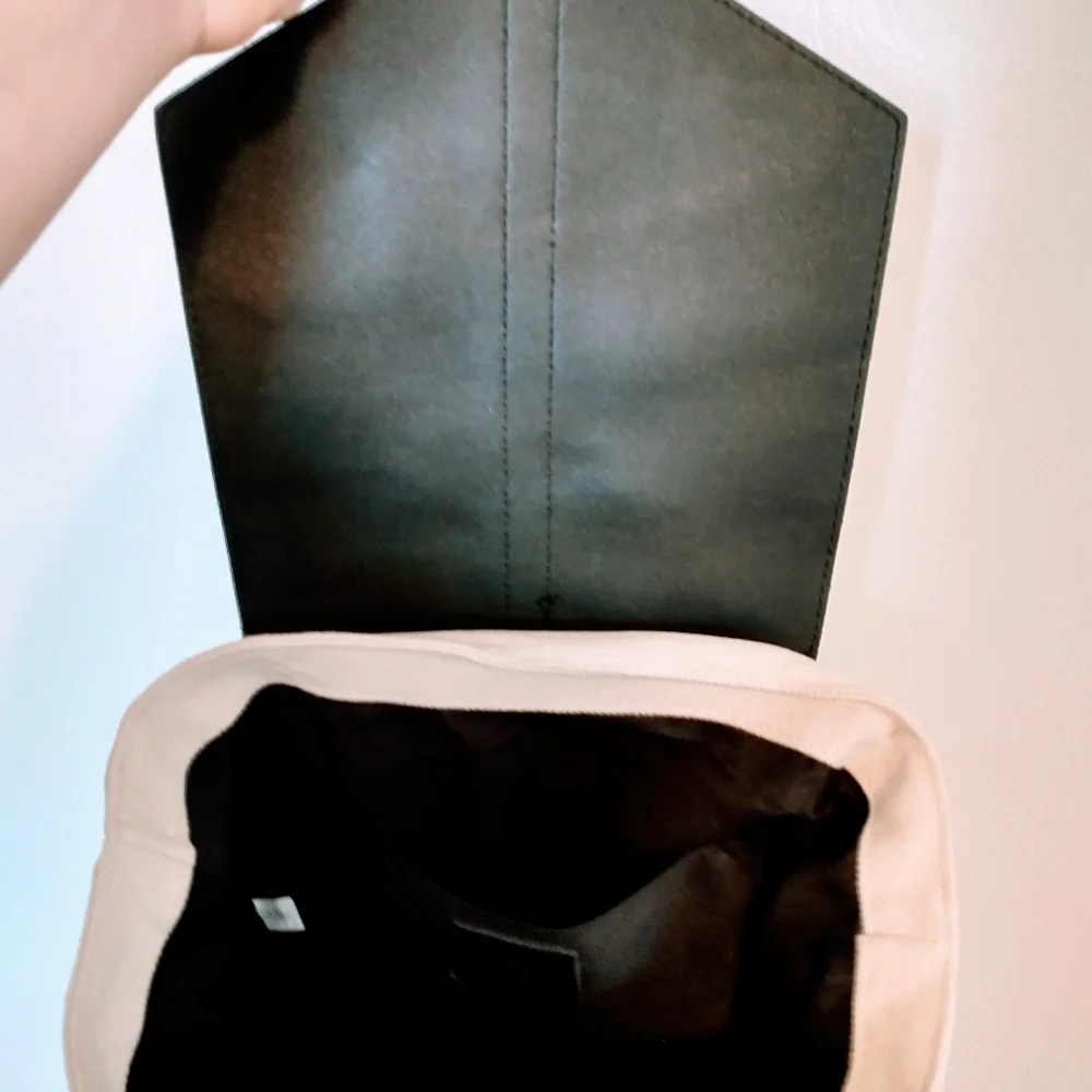 Deux Lux beige and black faux leather mini bag with buttons on the side to expan
